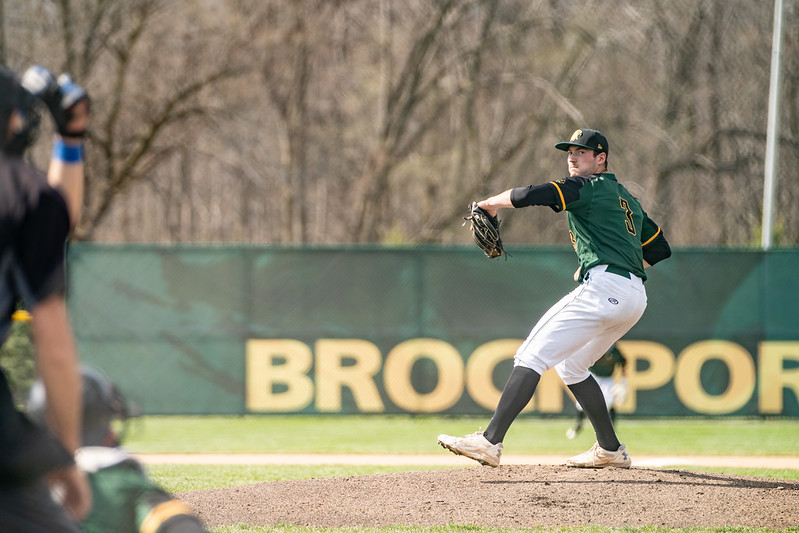 Tom Kretzler throws a pitch against SUNY Fredonia earlier this season. (Photo credit: Zach Lyman via Flickr)