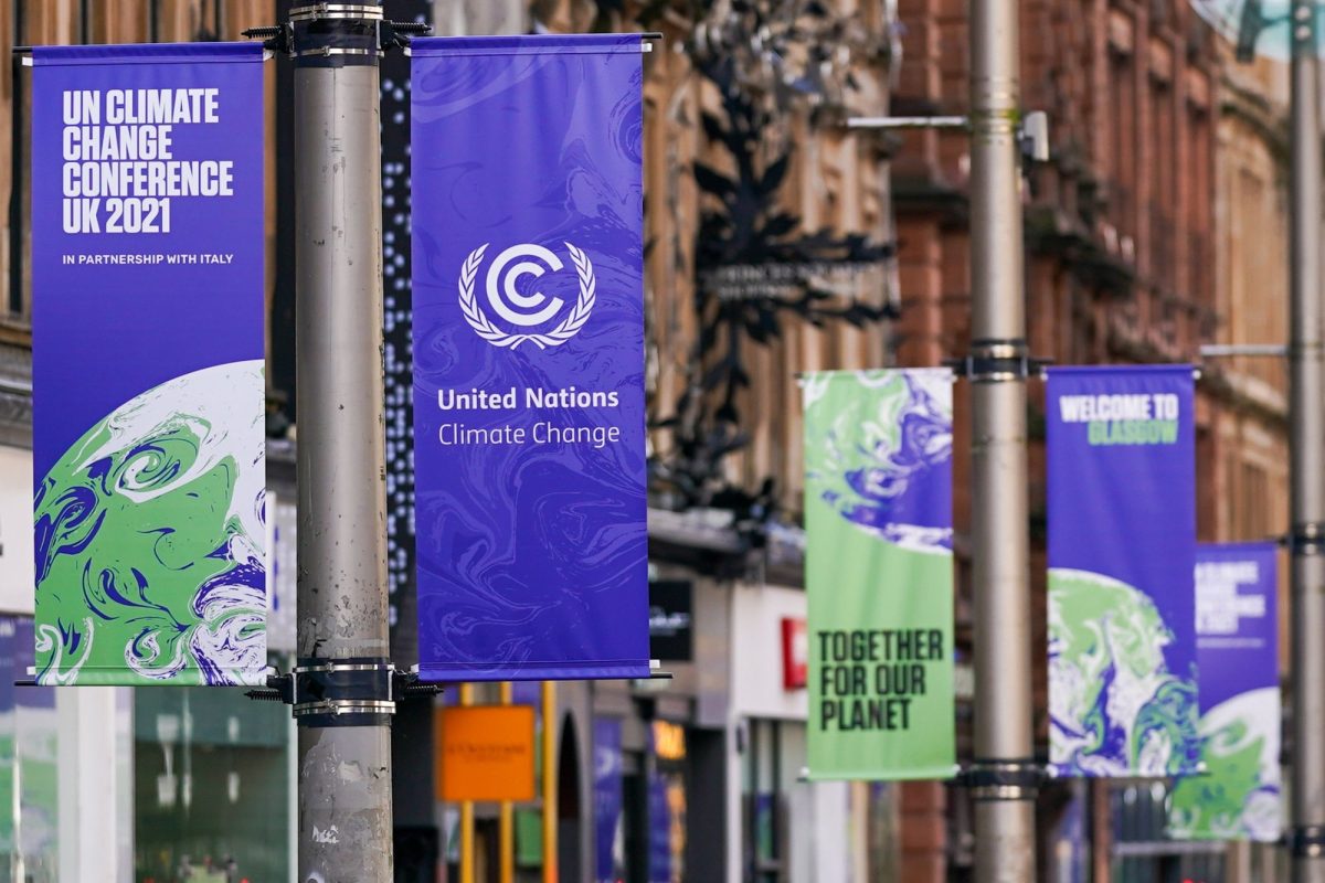 Banners advertising the upcoming COP26 climate talks in Glasgow, U.K., on Wednesday, Oct. 20, 2021. Glasgow will welcome world leaders and thousands of attendees for the crucial United Nations summit on climate change in November. Photographer: Ian Forsyth/Bloomberg