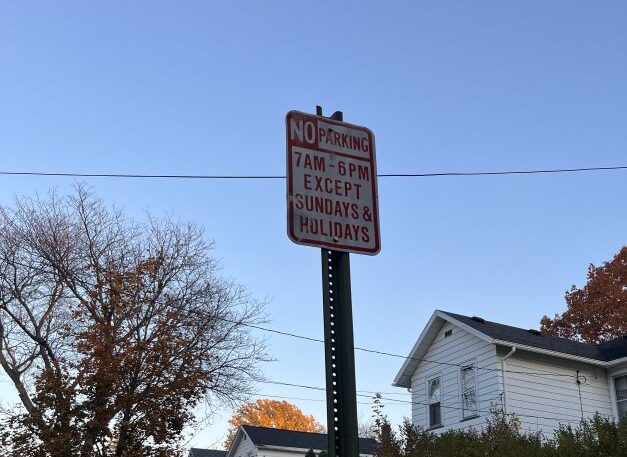 Parking sign posted on Brockway Place. (Photo Credit: Hallie Davis)