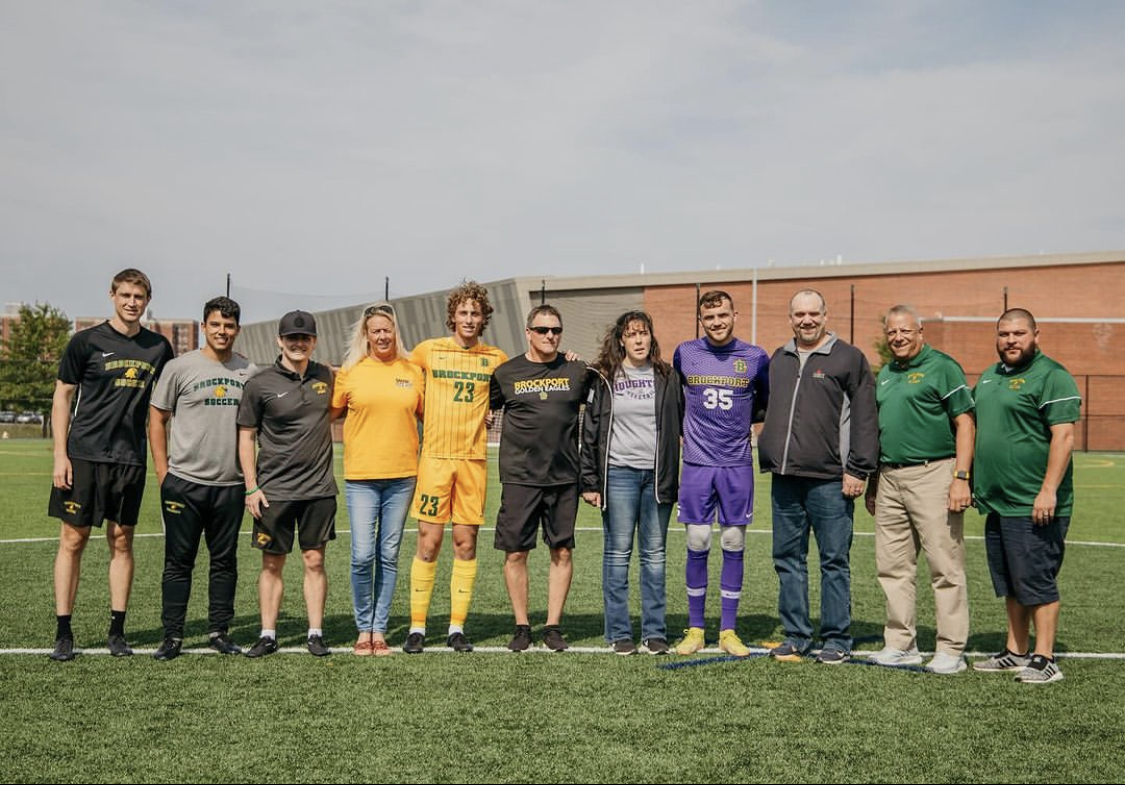 The Brockport seniors with their families. (Photo Credit: Liv Metz/Brockport Athletics)