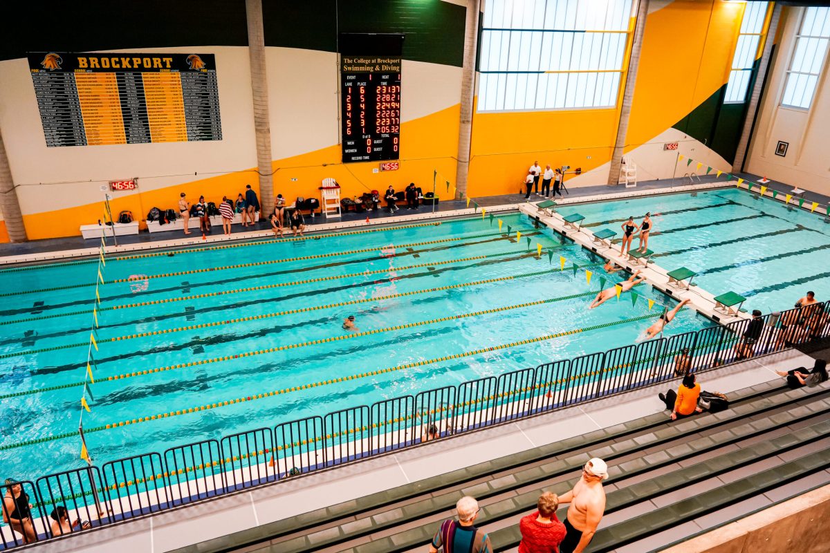 The Brockport mens and womens swimming and diving teams in action at the home opening meet. (Photo Credit: Leah Bisgrove/Brockport Athletics)