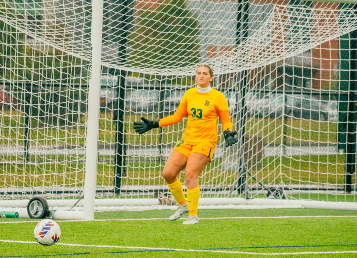 Madeline McCrosson positioning herself in front of the ball. Photo Credit: Brockport