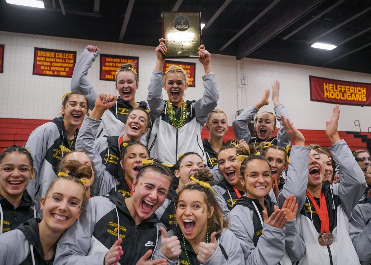 Last seasons Brockport gymnastics team celebrating its regional championship victory. (Photo Credit: Mathieu Starke).