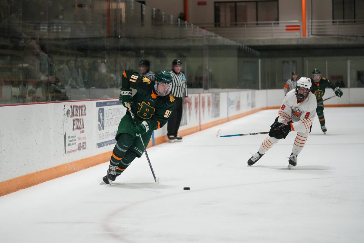 Brockports Chase Maxwell carries the puck against Buffalo States Tyler Penree in Fridays contest. (Photo Credit: Kaite Wilson/Brockport Athletics)