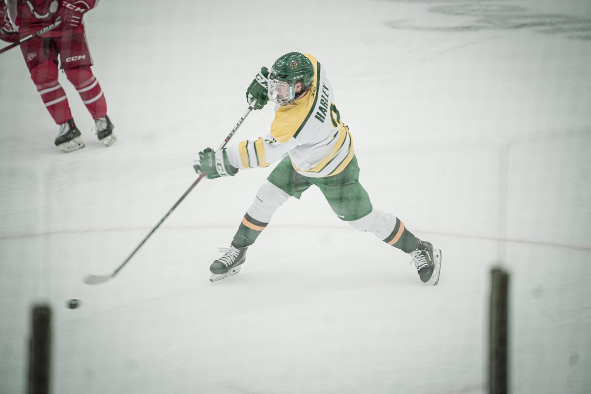 Brockports Andrew Harley playing the puck in Wednesdays loss. (Photo Credit: Myles Goddard/Brockport Athletics)