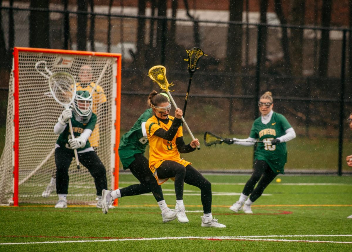 Brockport's Cassidy Burnash working to drive towards goal. Burnash recorded a goal and three assists in the win against Oswego.
