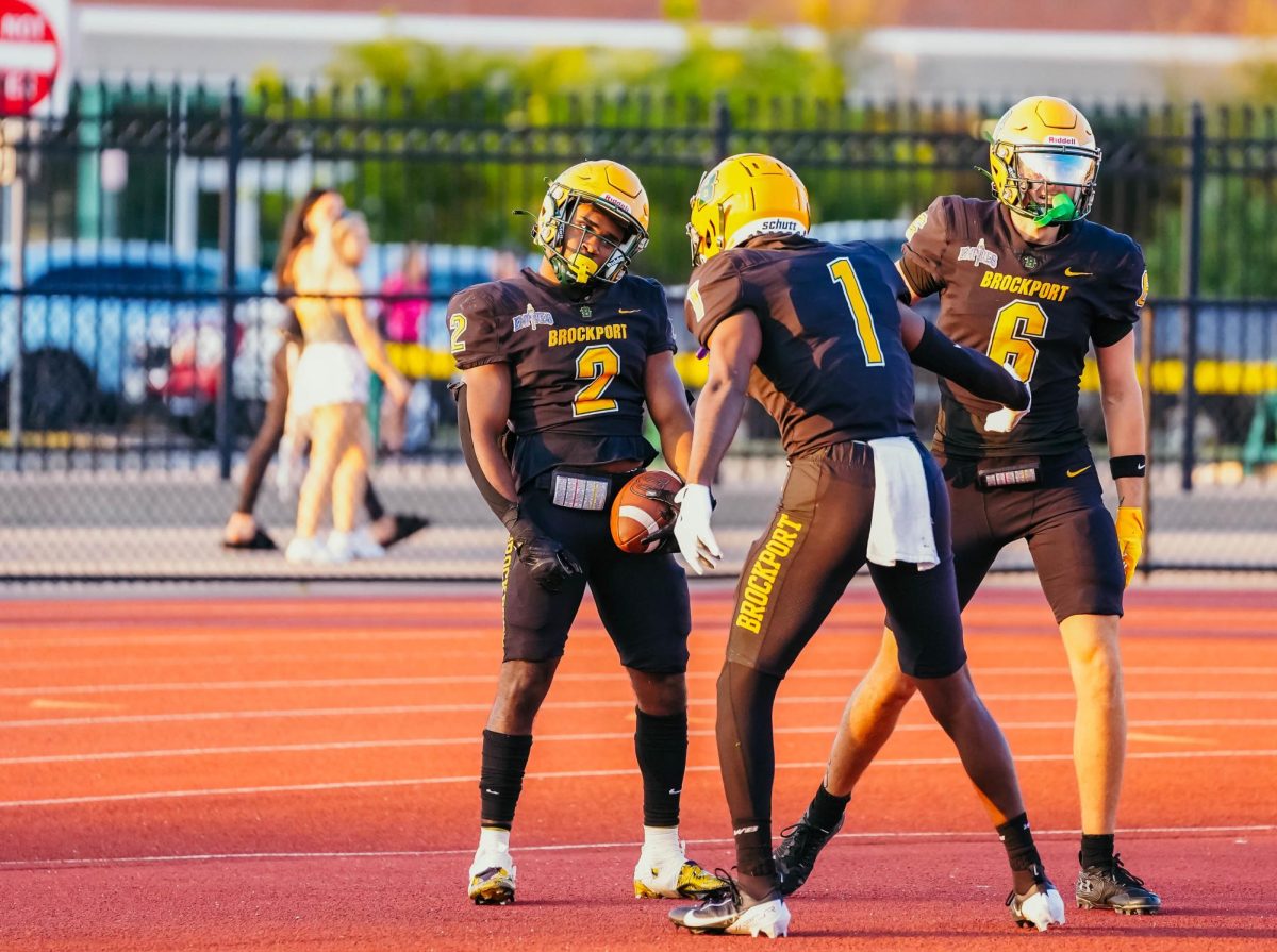 Simmons, left, after converting the touchdown for Brockport. 