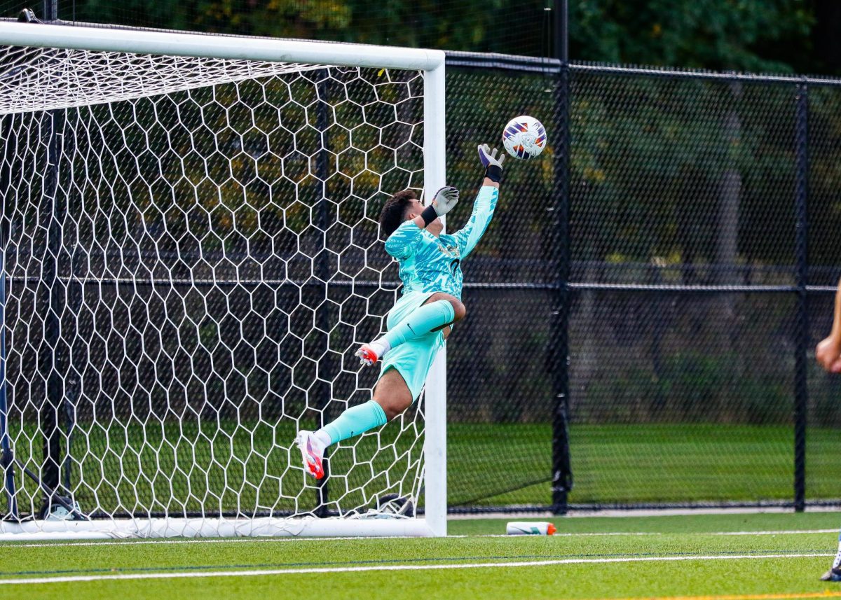 Dylan Lopez making a save for Brockport.