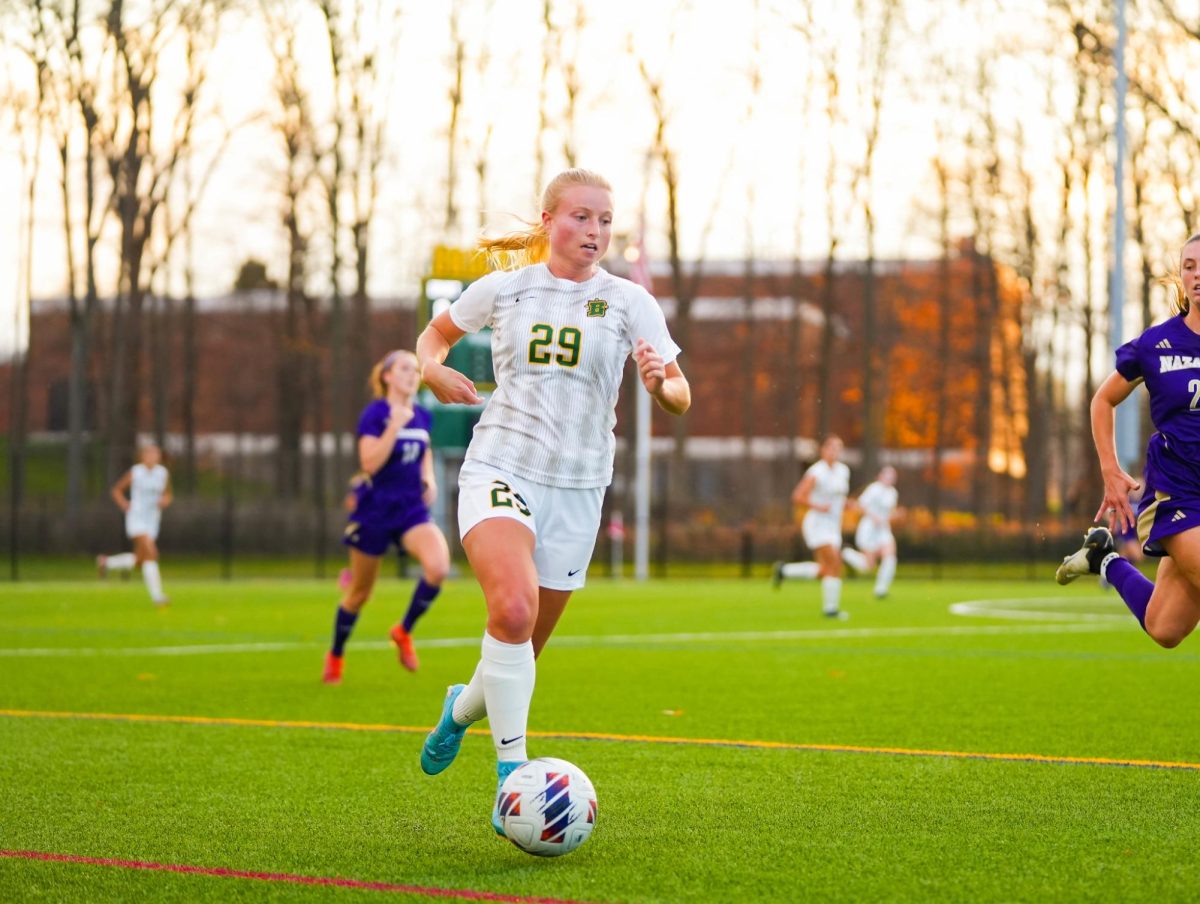 Caitlin Nelson with the ball in Brockport's semifinal matchup with Nazareth.