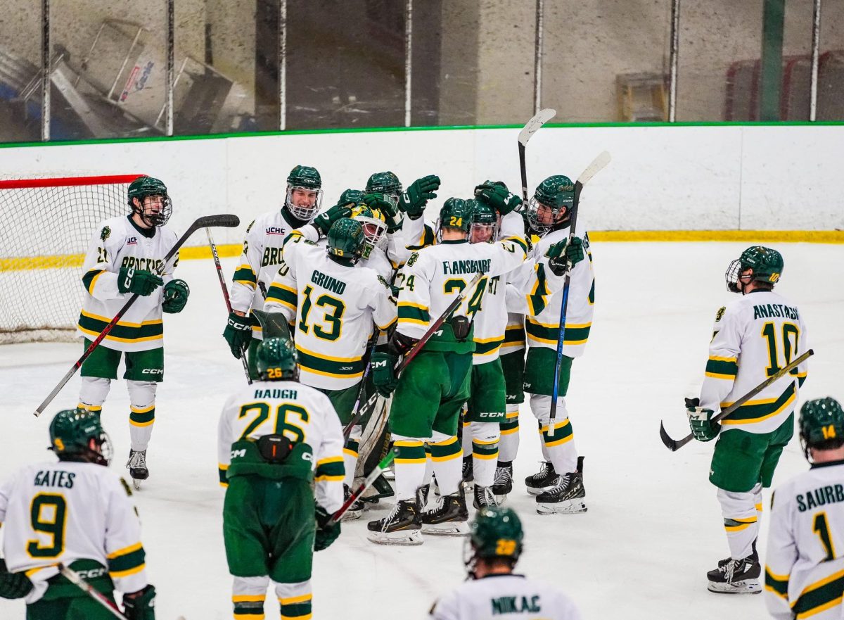 Filak (center) being celebrated by his team. The sophomore from Northville, MI has played in 12 games this season for the Golden Eagles.