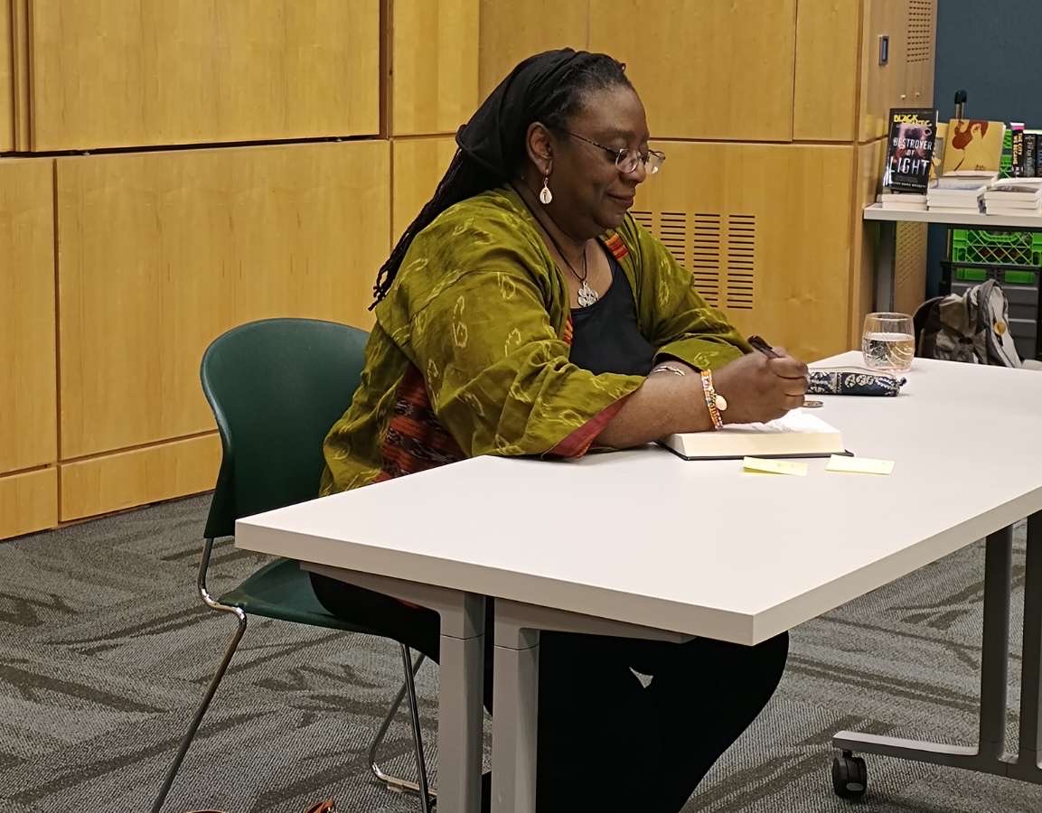 Author Jennifer Marie Brissett signing books, Brockport, N.Y. (Photo Credit: Olivia Robinson) 