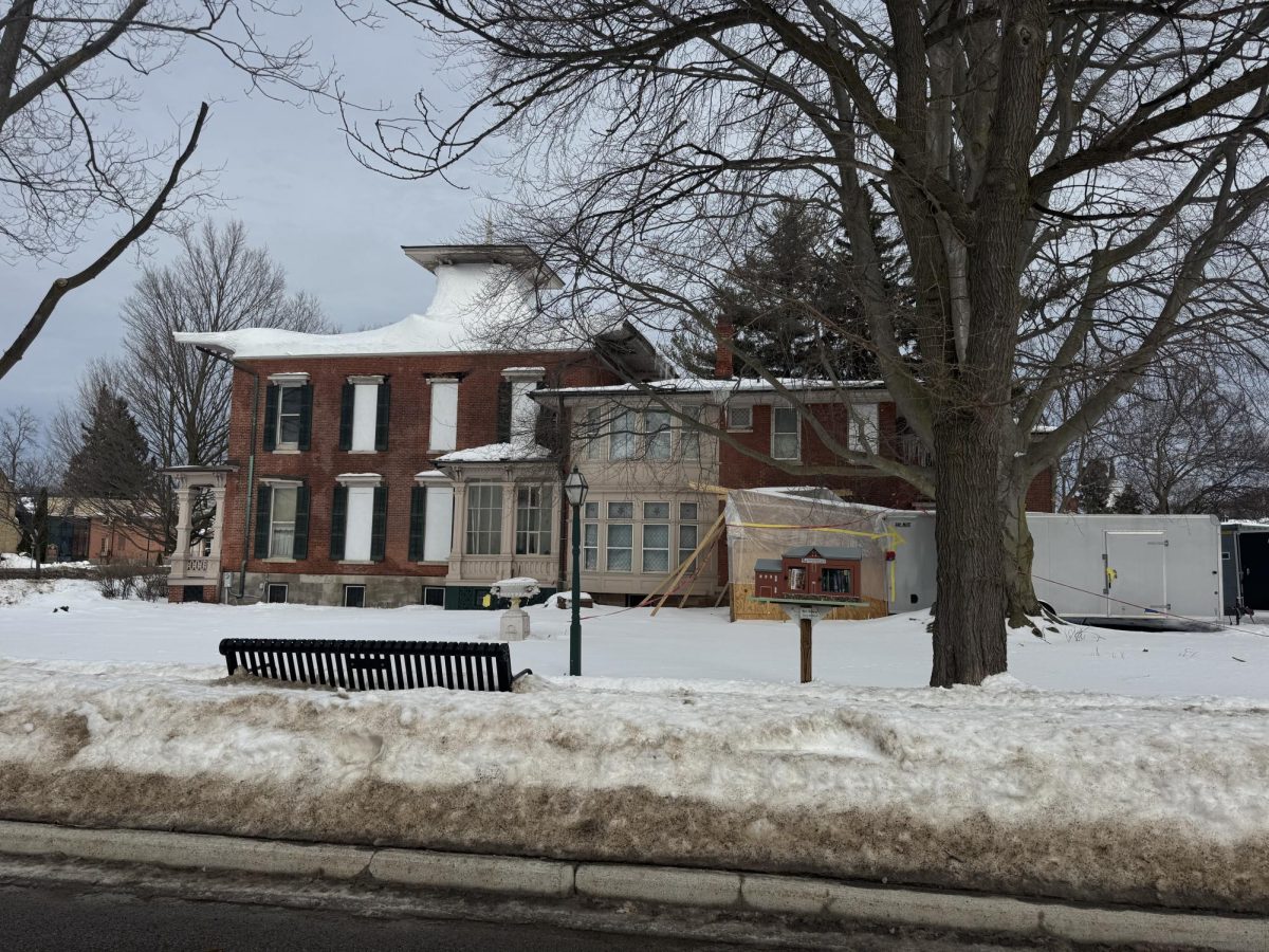 The Morgan-Manning house remains wrapped with tarp after a destructive fire.