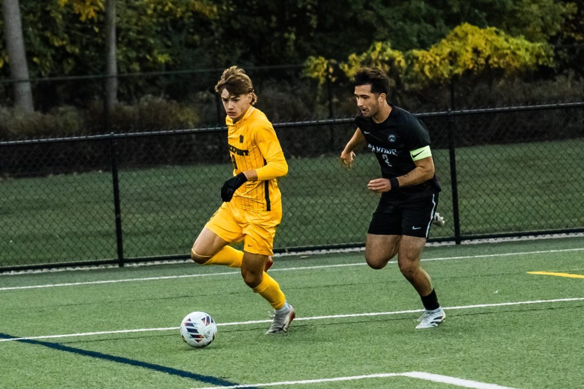 Ryan Mathis with the ball for Brockport. Mathis leads the Golden Eagles in goals this season.