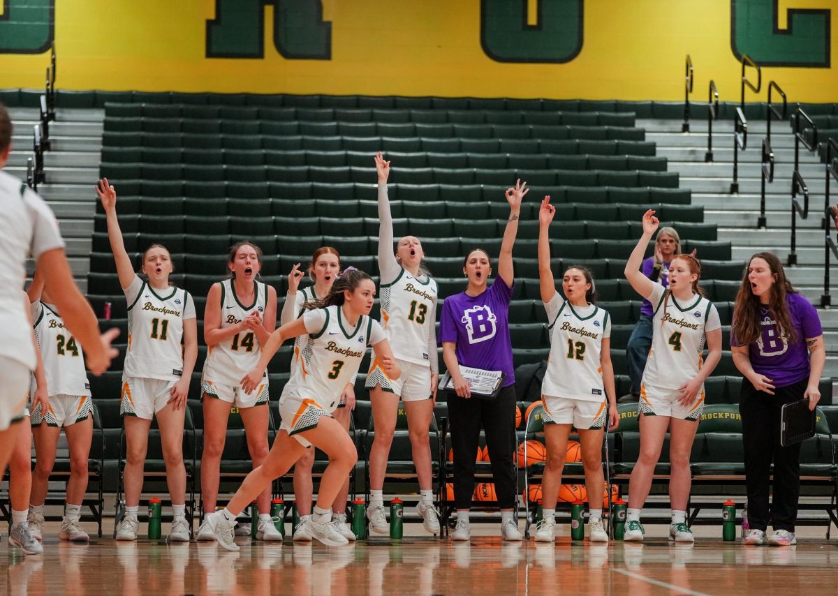 The Brockport bench celebrating after  a bucket. 