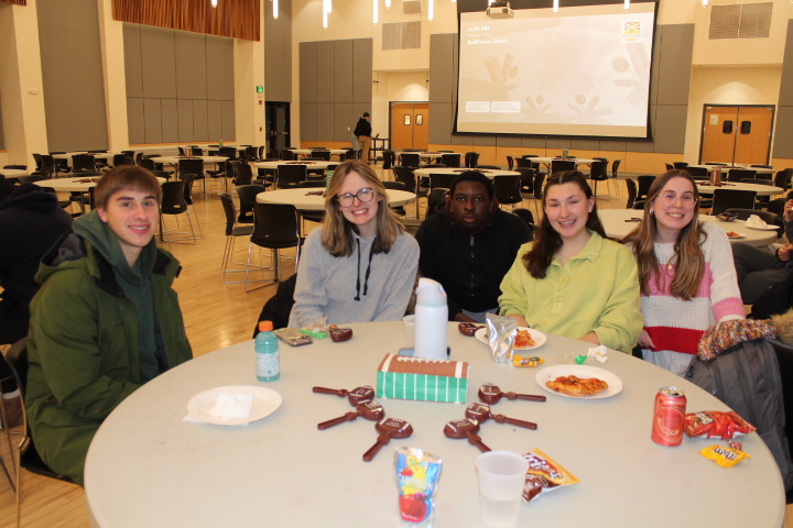 Students eat dinner and watch Super Bowl LX in the Seymour Ballroom at The Big Game Watch Party.