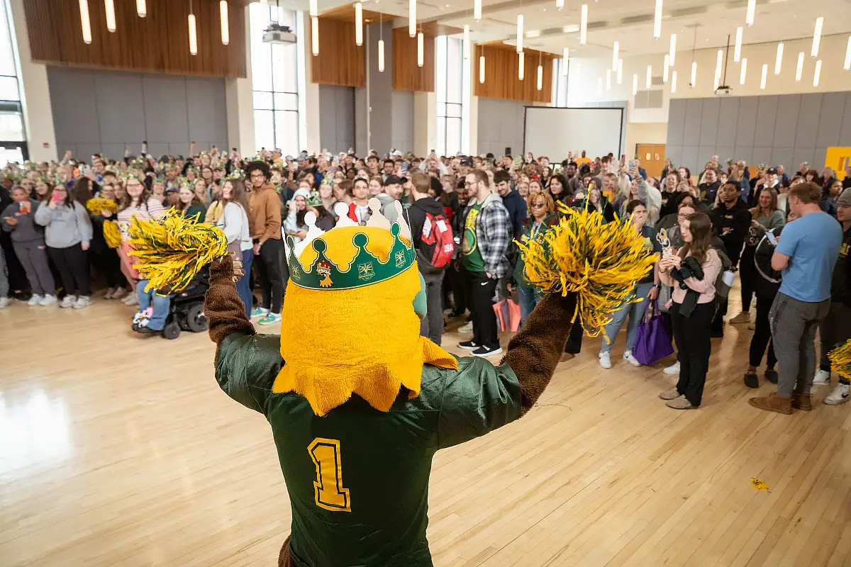 SUNY Brockport celebrates with Ellsworth Eagle after he won SUNY Mascot Madness in 2024.