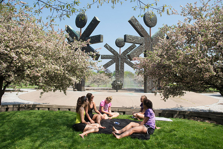 Students enjoy Brockport's campus during springtime.