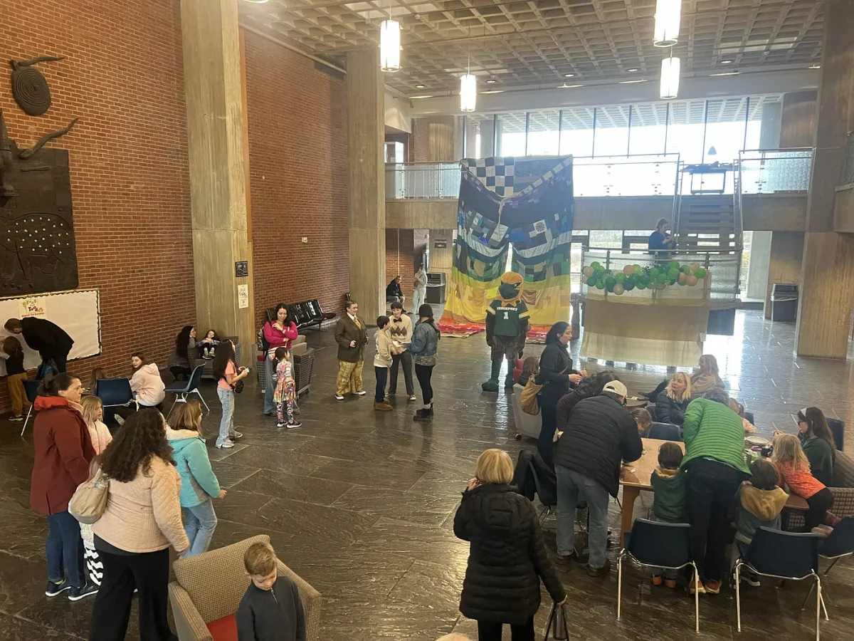 Families gather in the Tower of Fine Arts Building for the pre-show Frog and Toad meet and greet.